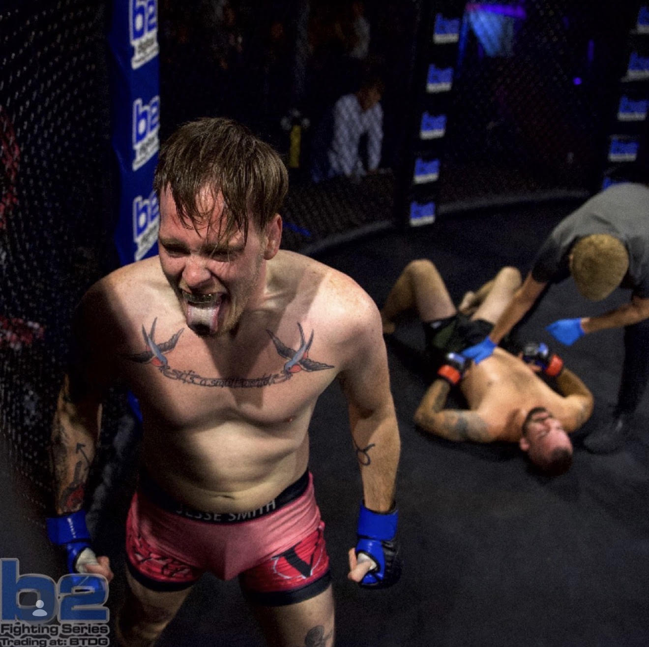 MMA fighter celebrating intensely during competition